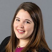 A professional headshot of Raquel Tranquada