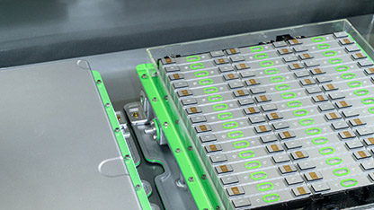 A machine featuring green and white components, showcasing a modern design and industrial functionality.