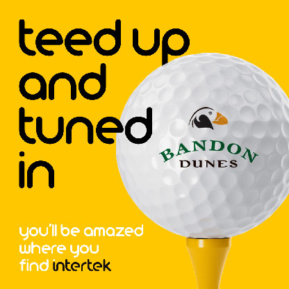 A golf ball with the Bandon Dunes logo sitting on a tee